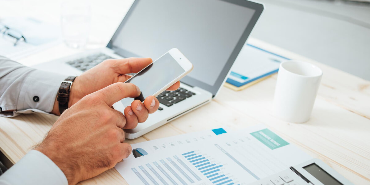 A professional seamlessly managing work while traveling, thanks to dependable transfer services