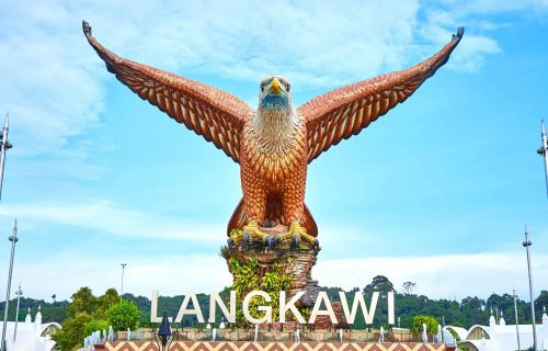 Popular photo spot featuring a huge eagle statue perched over a scenic waterfront plaza.